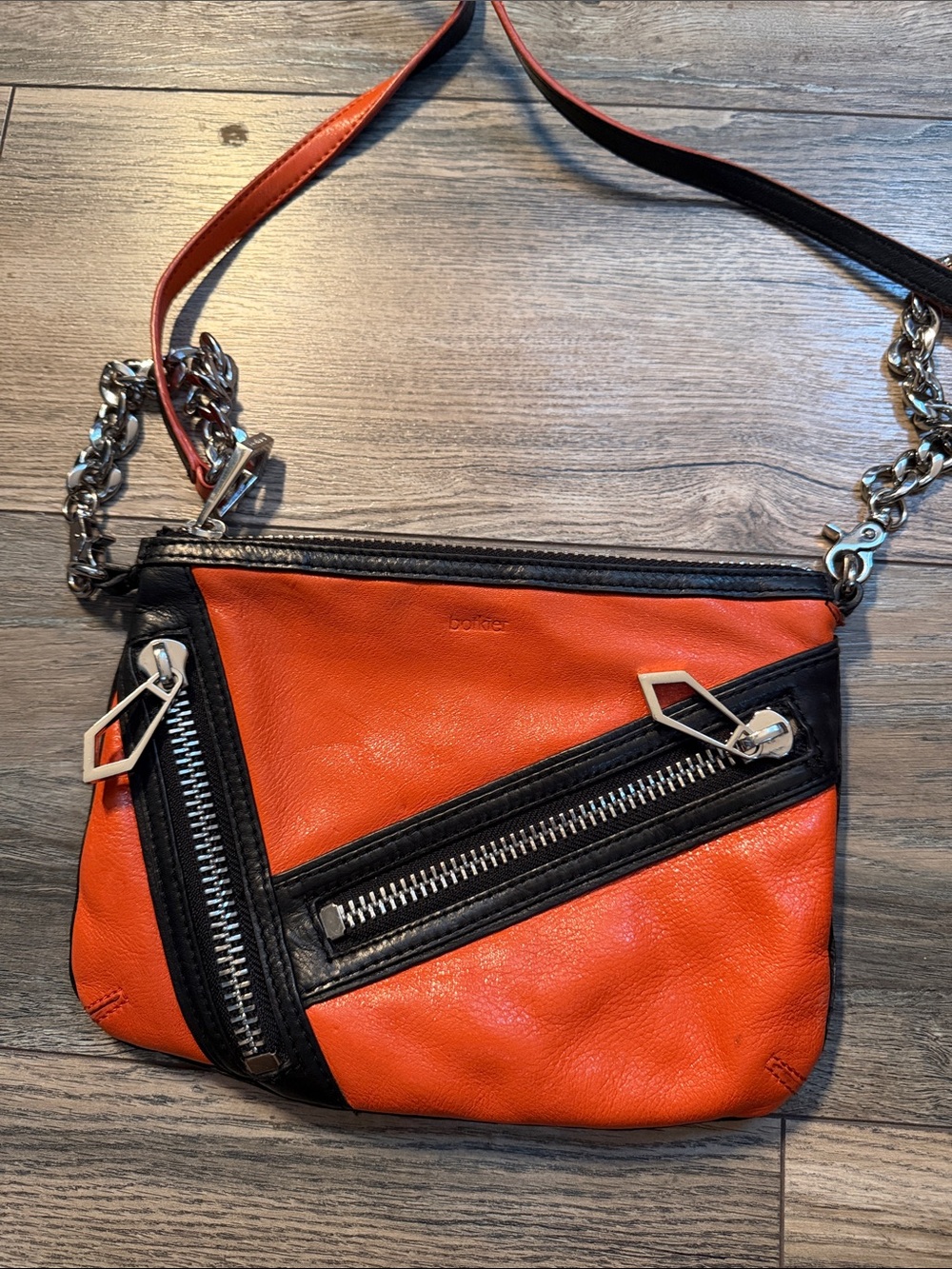 Vintage Botkier Orange and clack leather crossbody bag with removable strap.